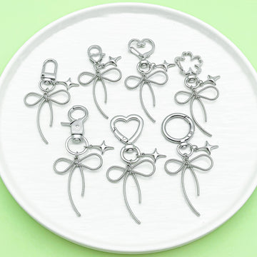 Butterfly Charm Keychains Featuring Silver Bow Across 8 Pictured Variations