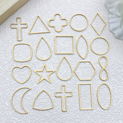 Gold-tone star charms arranged on a light background