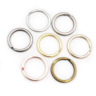 Assorted metal split key rings in multiple sizes and finishes arranged together in the main product view