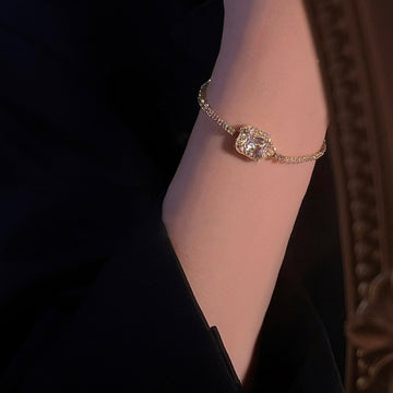 Gold Tone Tennis Bracelet With Square Clear Crystal Halo Center