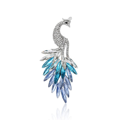 Front view showing the silver tone peacock brooch with layered crystal tail feathers