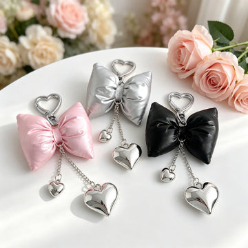 Metallic PU Leather Bow Charm With Dangling Heart Pendants