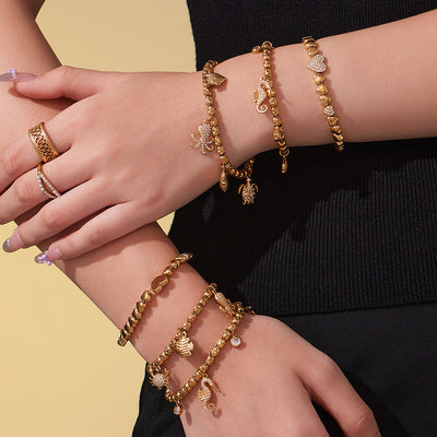 On-wrist view of seahorse octopus heart crystal bracelets in main image 1.