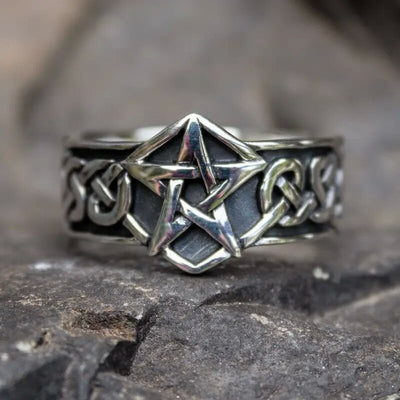 Front face of antique silver pentagram band ring on stone