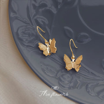Gold Butterfly Dangle Earrings Textured Wing Metal Hooks