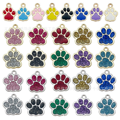 Colorful cat paw charms arranged on a light background