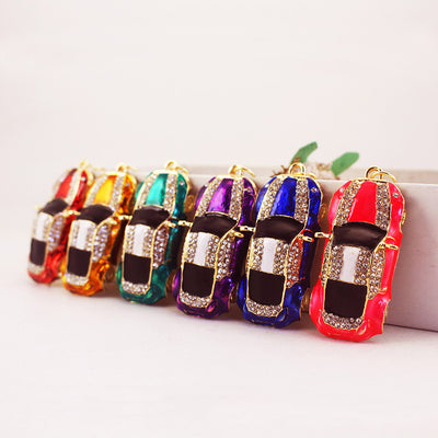 Six rhinestone car charms in red, gold, green, purple, blue, and pink.