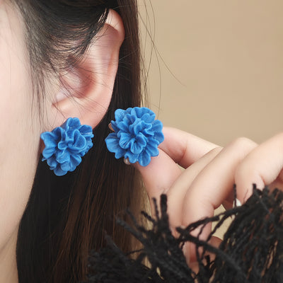 Primary supplied view of blue chrysanthemum statement studs