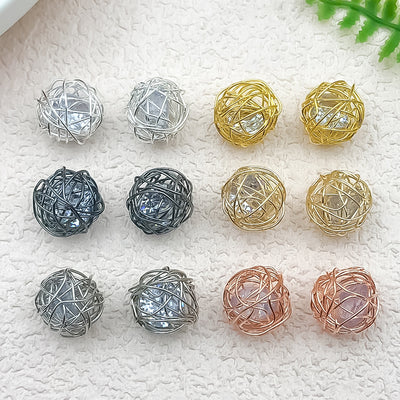 Metallic flower beads arranged on a light background