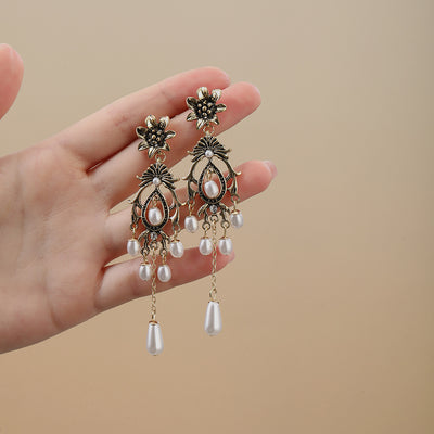Primary supplied view of antique gold flower pearl-look chandelier earrings