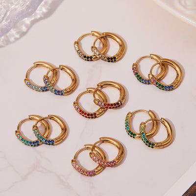 Grouped style view of slim crystal hoop earrings in seven colors in main image 1.