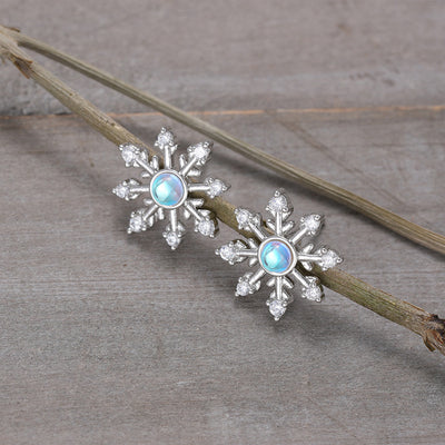 Image 1 showing blue center snowflake stud earrings