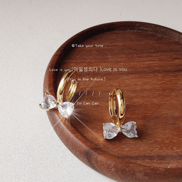 Gold-Tone Huggie Hoop Earrings Clear Crystal Bow Charms