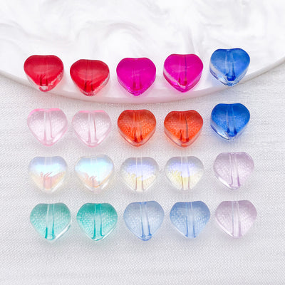 Colorful heart beads arranged on a light background