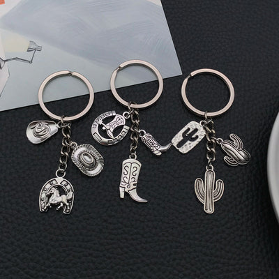 Overview showing the available color and design variations of the antique silver horse boot and cactus metal keychain