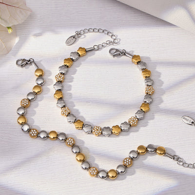 Two-tone flower bead bracelet and round bead bracelet flat lay