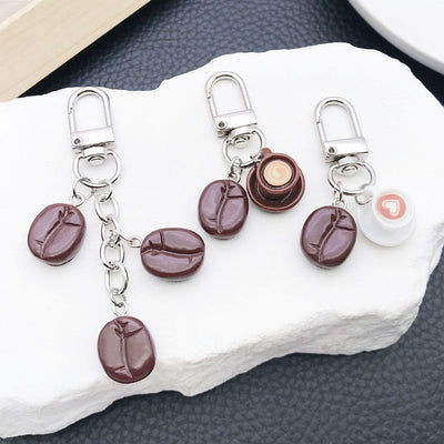 Main display of white cup brown cup or three coffee bean keychains