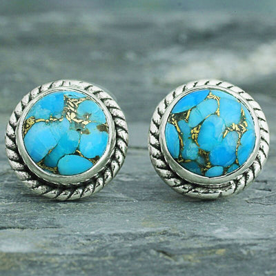 Antique silver rope bezel turquoise round studs on slate surface