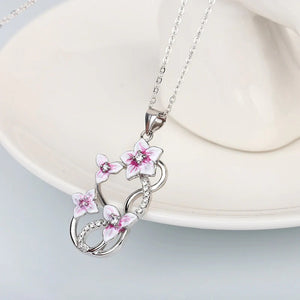 Pink Blossom and Butterfly Pendant Necklace with Polished Metal Finish
