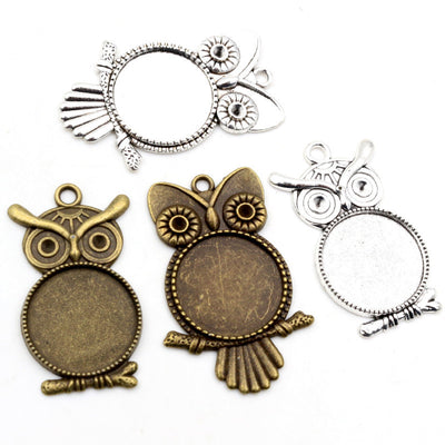 Owl Shaped Round Cabochon Pendant Bezel Settings, grouped overview on a plain background