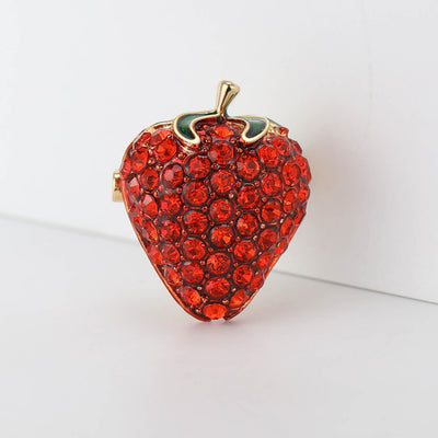Red rhinestone strawberry brooch with green enamel leaves front view
