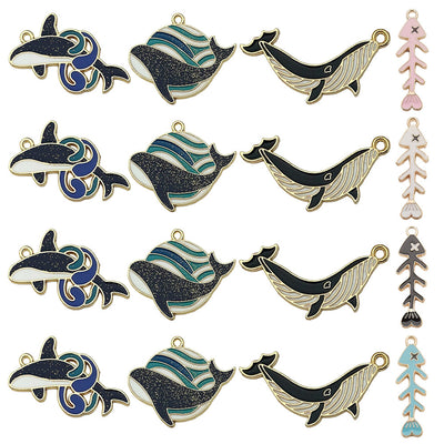 Colorful dolphin and whale charms arranged on a light background