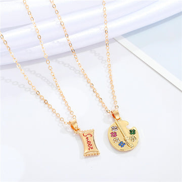 Gold Tone Artist Palette and Sweet Wrapper Pendant Necklaces