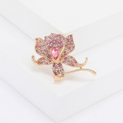 Front view of the pink crystal rose brooch showing a rose-gold-tone rose set with pink and clear crystals