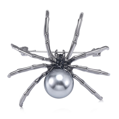 A long-legged spider centered by a large pearl-like bead shown on a white background