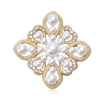 Front view of a symmetrical filigree flower set with white pearls and clear crystals