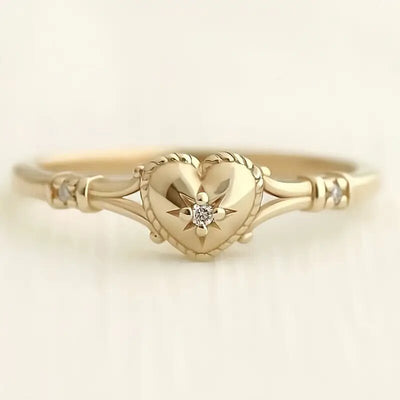 Gold heart star clear stone band ring front studio shot