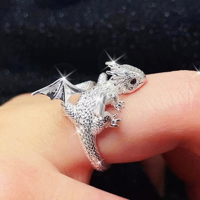 Silver mini dragon wrap ring worn on finger sparkle