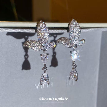 Crystal Butterfly and Teardrop Earrings with Polished Metal Details