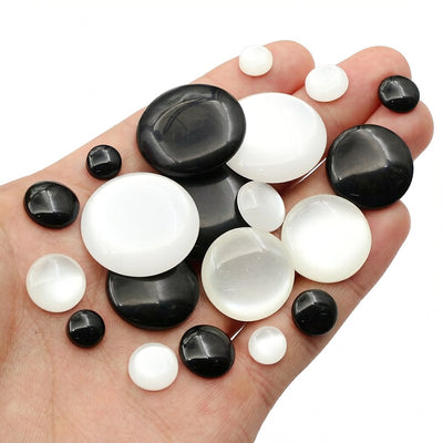 Oval cabochons arranged assortment on a white background
