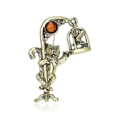 Front view of the cat and vintage telephone brooch in silver and bronze brooch and its color options