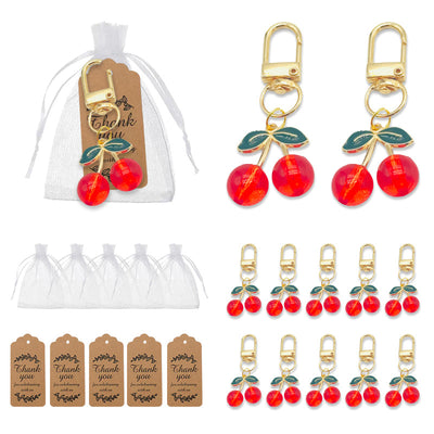 Collage of red cherry keychains with white organza bags and printed thank-you tags.