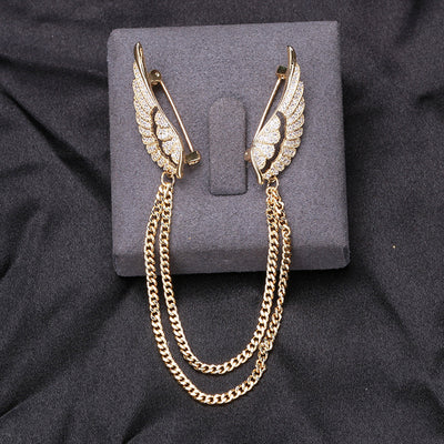 Gold angel wing dual pin brooch with double chains on grey block