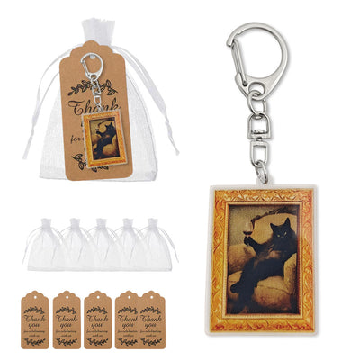 Packaging overview showing the cat keychain, white drawstring bags, and brown thank-you tags.