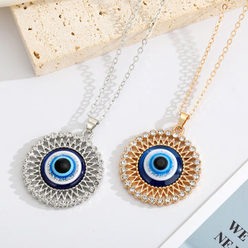 Round Crystal Halo Blue Evil Eye Necklaces in Two Finishes