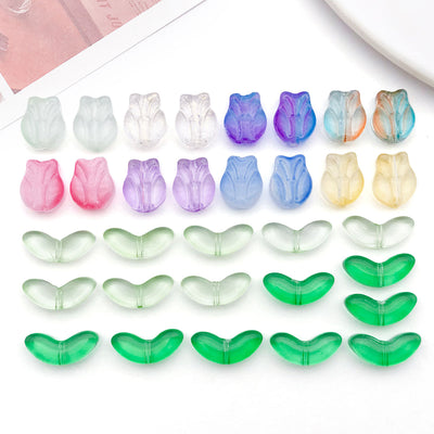 Colorful leaf and bead beads arranged on a light background