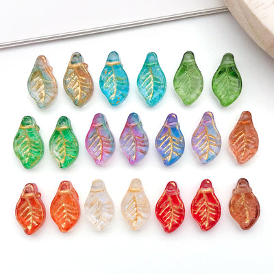 Metallic leaf beads arranged on a light background