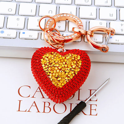 Main image 1 shows a supplied presentation of jeweled gold heart keychains with visible attached key hardware.