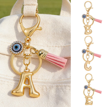 Gold Tone Initial Keychains A to L with Eye Charm and Pink Tassel