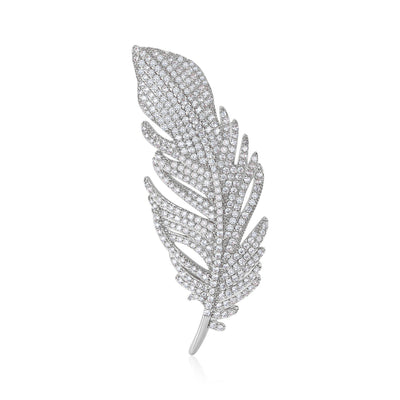 Silver-tone pave clear crystal feather brooch on white background