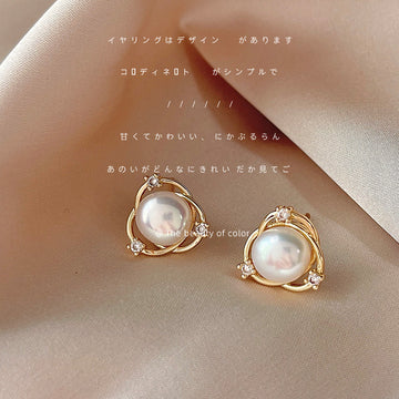 Gold Tone Crossed Circle White Pearl And Clear Stone Stud Earrings