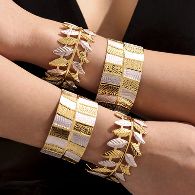 Models wearing gold silver leaf and checkered open cuff bracelets