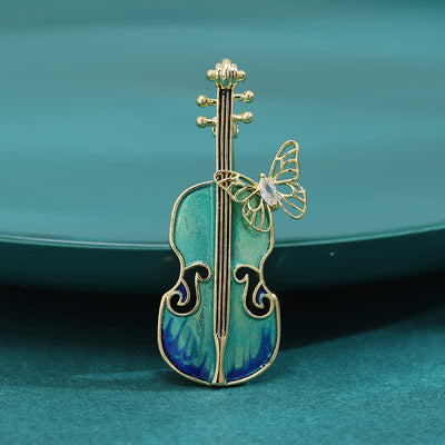 enamel cello and butterfly brooch group view
