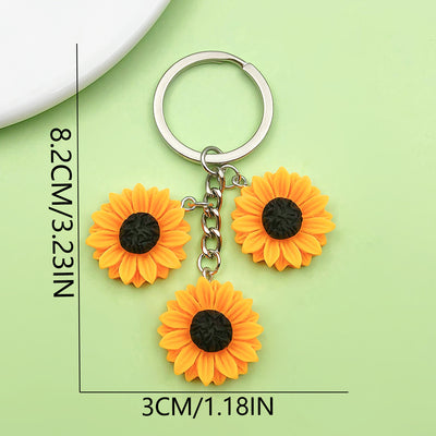Dimension graphic showing sunflower and flower keychains with printed 8.2CM/3.23IN and 3CM/1.18IN measurements.