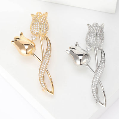 gold or silver tulip brooch with clear crystal petals isolated on a white background