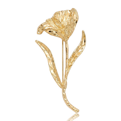 Gold polished tulip flower brooch on white